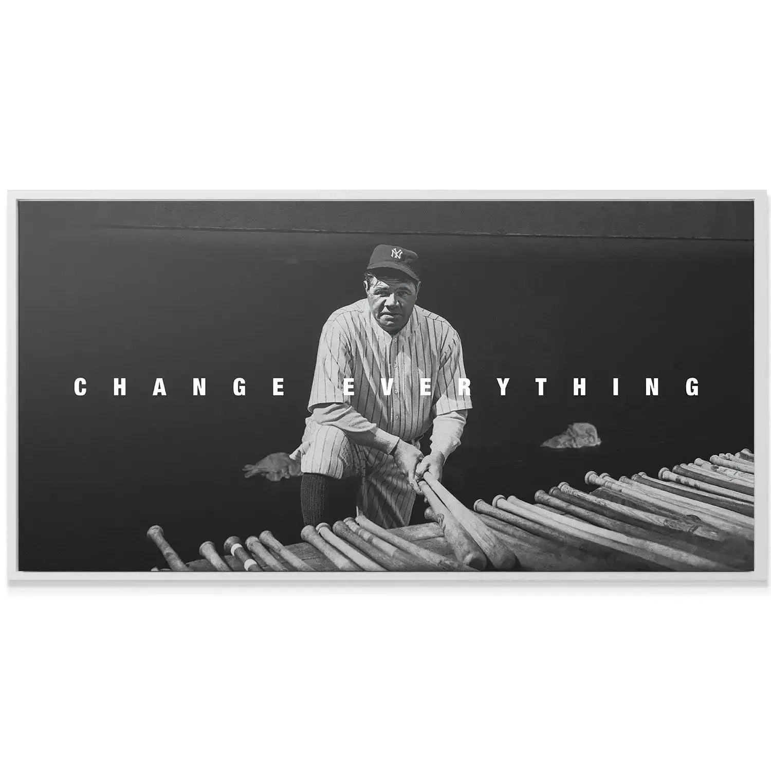 Motivational wall display of the black and white canvas, showing 'Babe Ruth - Change Everything' in an office setting.