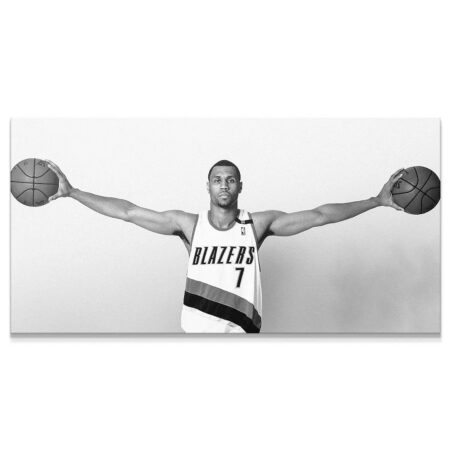 Full studio shot of Brandon Roy - Arms extended, holding basketballs against a clean backdrop.