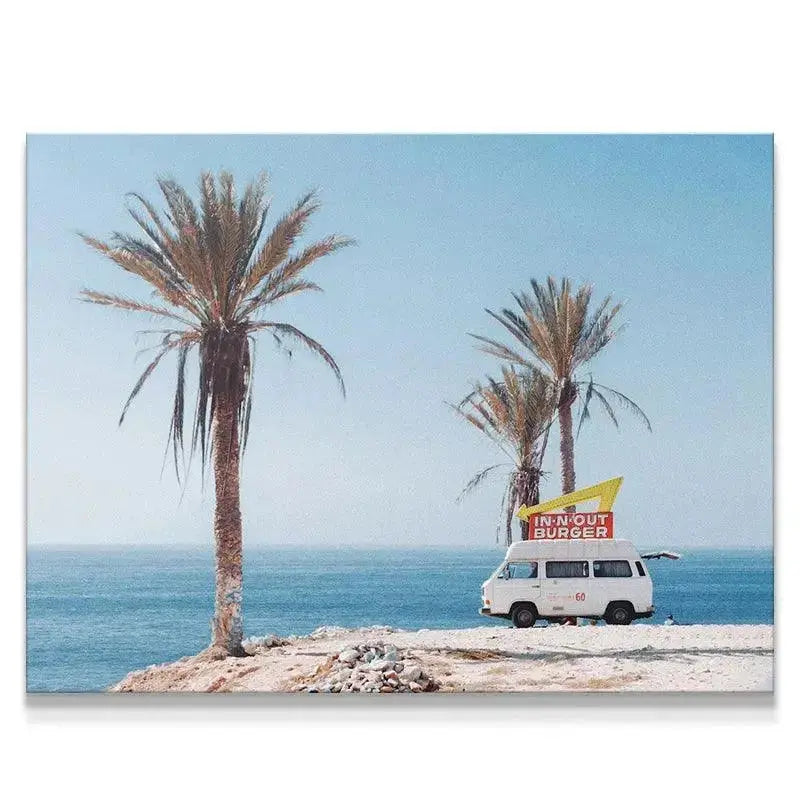 Side view of the vintage white Burger Truck parked on a dusty cliff edge overlooking the sea.