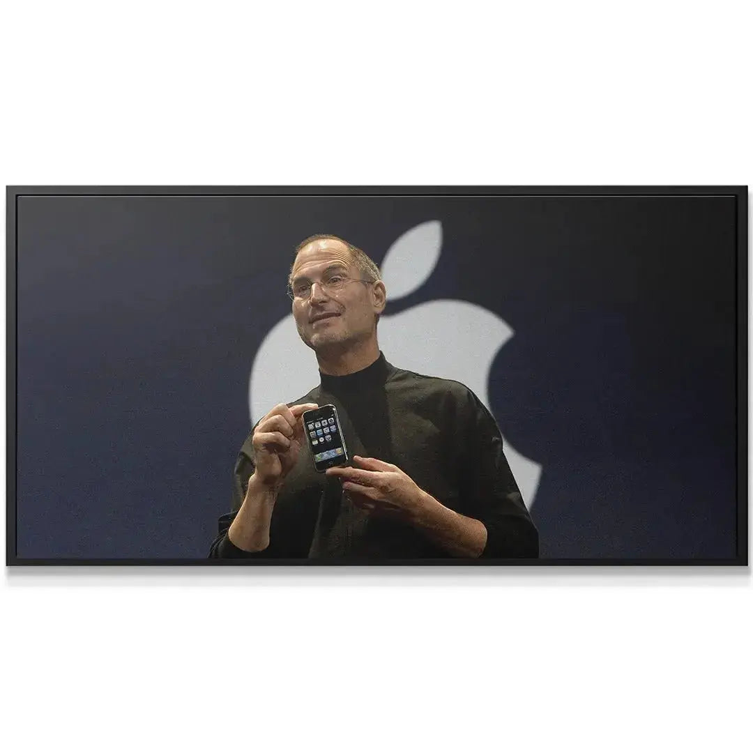 Wide angle view of the presentation stage with the giant Apple logo backdrop, representing Change the World (No Quote).