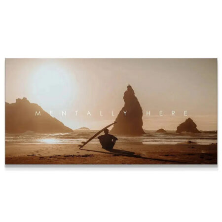 Wide view of surfer silhouette and towering sea stacks at golden hour in 'Chris Henry - Mentally Here' art print.