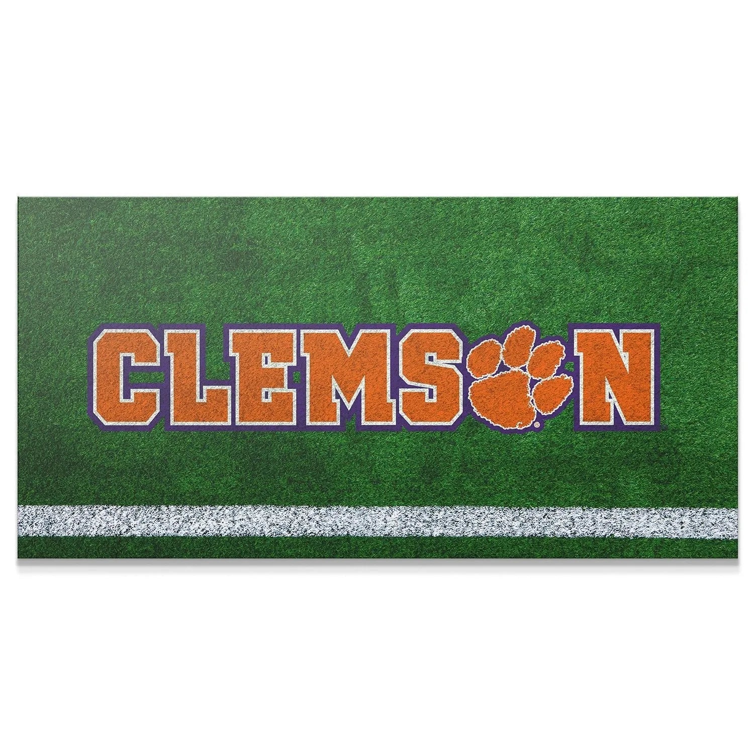 Close-up shot of the vibrant orange and purple text of the Clemson - Field Logo on artificial turf.