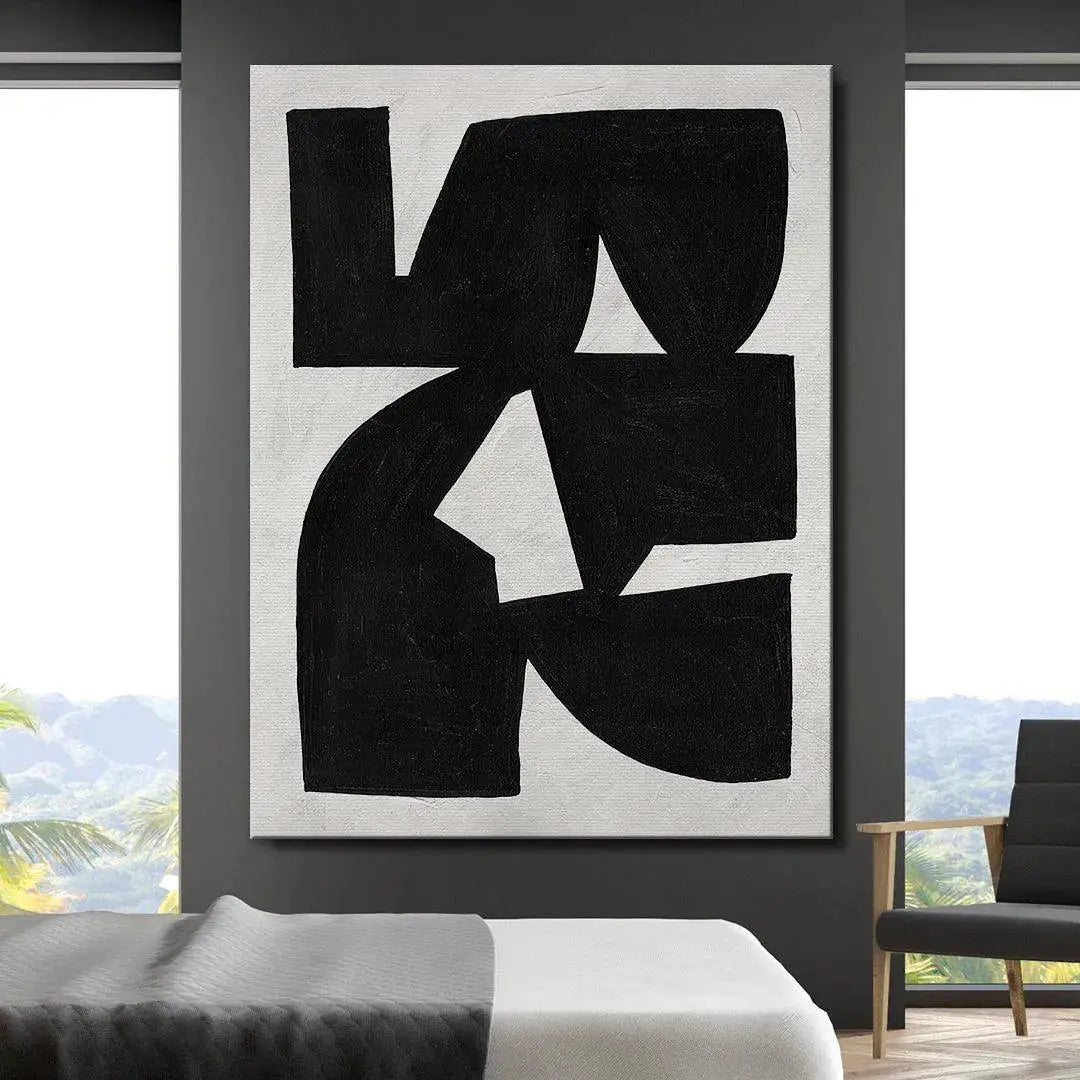 Lifestyle shot: 'Colliding Shapes Black N.1' hanging above a minimalist mid-century modern credenza.