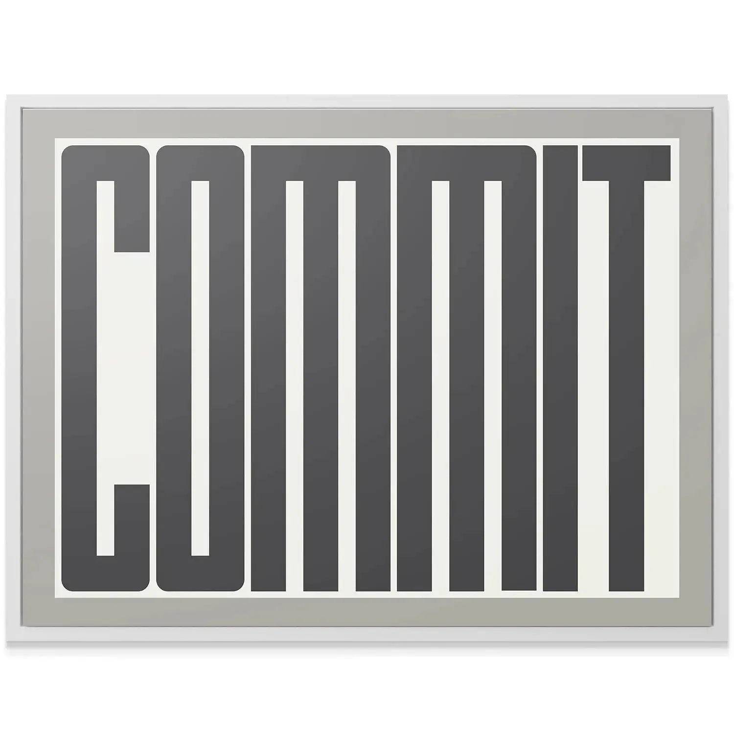 Side profile angle showcasing the canvas depth and the subtle gray border of the Commit print.