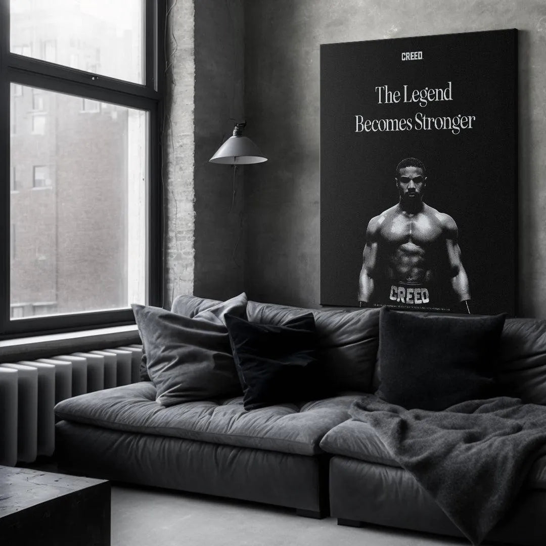 Low-angle view emphasizing the powerful stance of the boxer in the Creed - The Legend image.