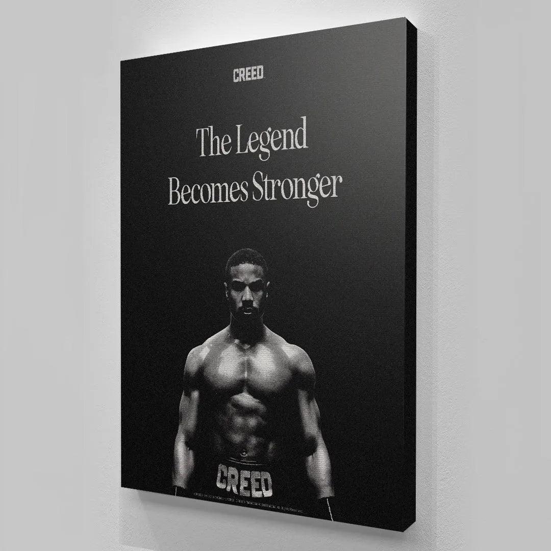 Monochromatic boxing poster detail featuring the title text "The Legend Becomes Stronger" in Creed - The Legend.