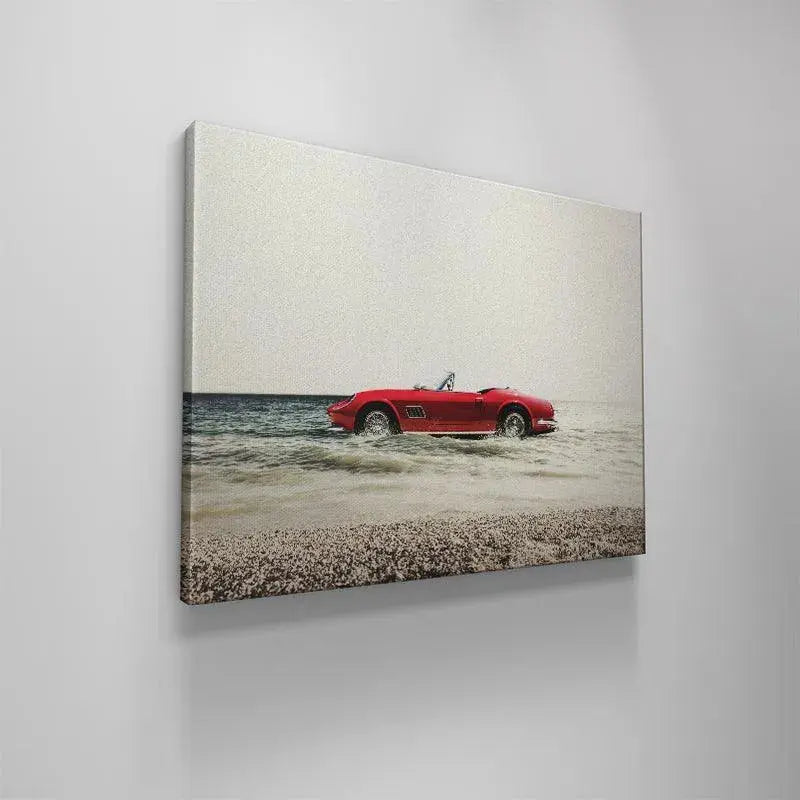 Side profile of the luxurious red convertible contrasting with the ocean during a surreal Day Off adventure.