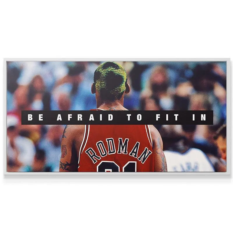 Lifestyle mockup featuring the motivational print 'Dennis Rodman - Be Afraid To Fit In' displayed on a contemporary wall.
