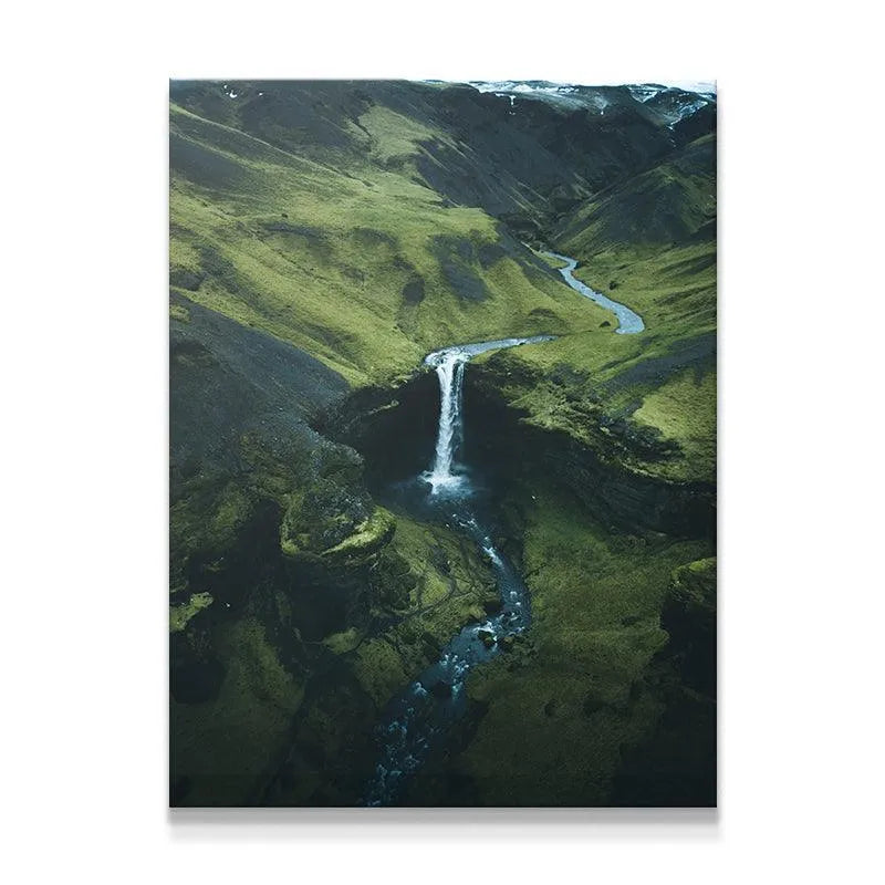 Aerial overview of Icelandic waterfall captured by DJI drone technology.