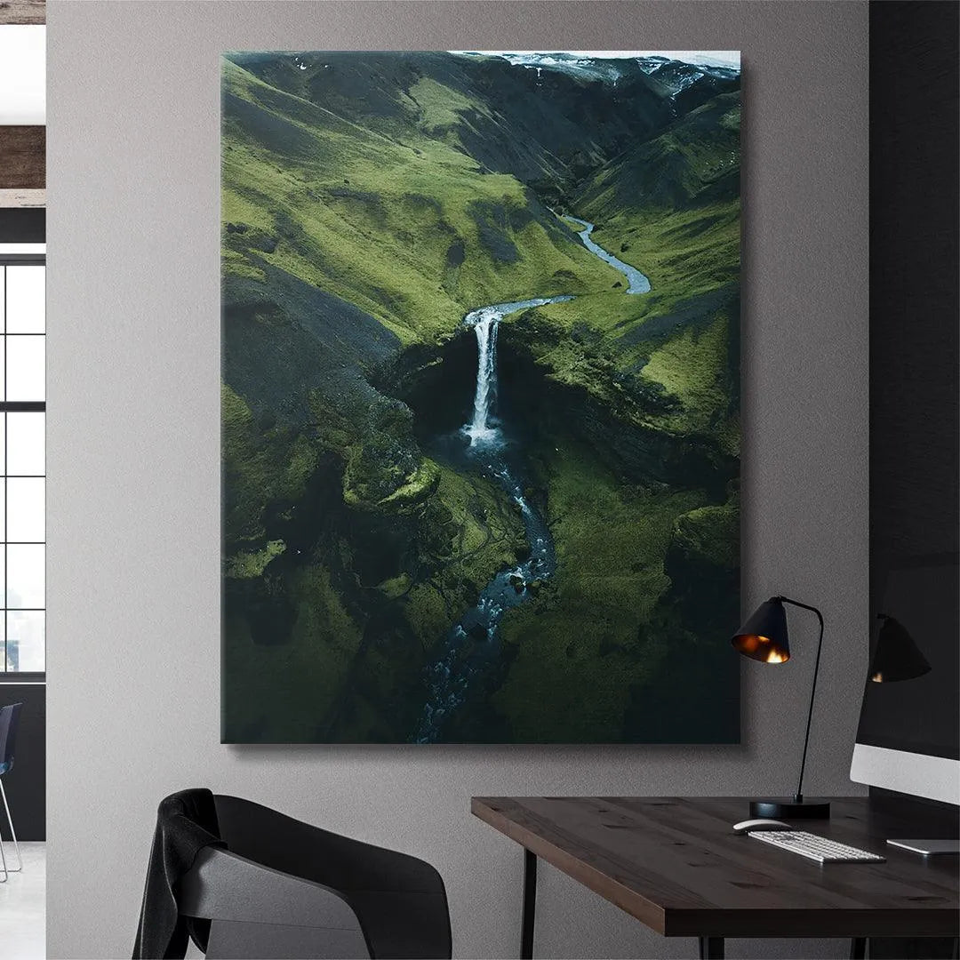 High-angle view of the waterfall source feeding the valley stream, shot by DJI equipment.