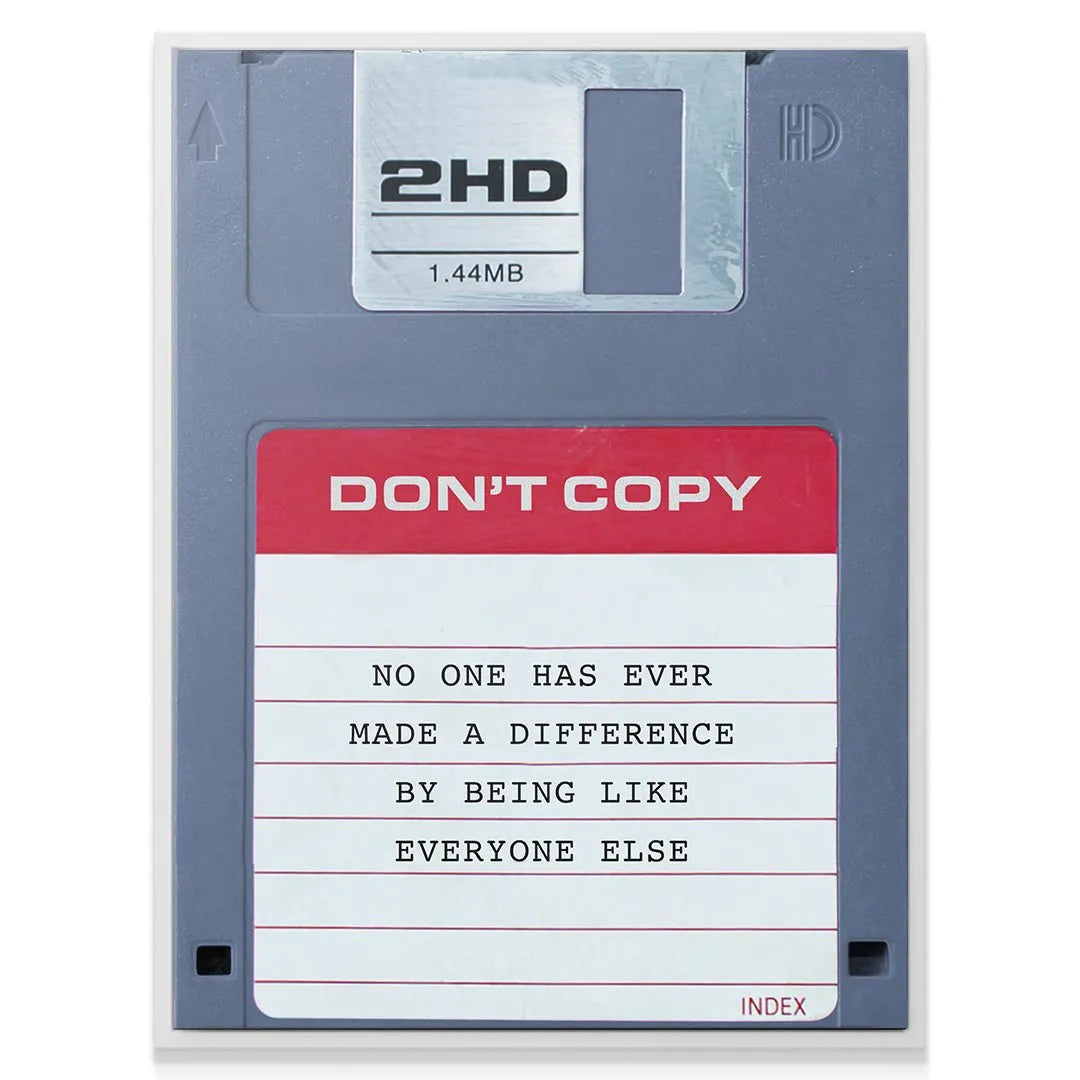 Angled view of the motivational floppy disk print emphasizing the powerful 'Don't Copy' message.