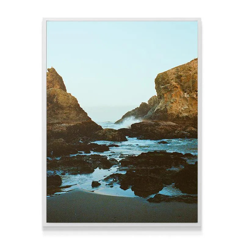 Wide-angle shot showing the tall, dramatic rock formations framing the misty ocean vista in Dreaming In Bandon.