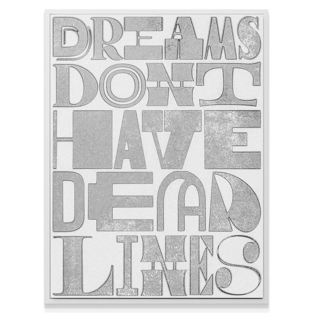 Lifestyle shot of the motivational canvas 'Dreams Don't Have Deadlines' hanging above a modern desk.