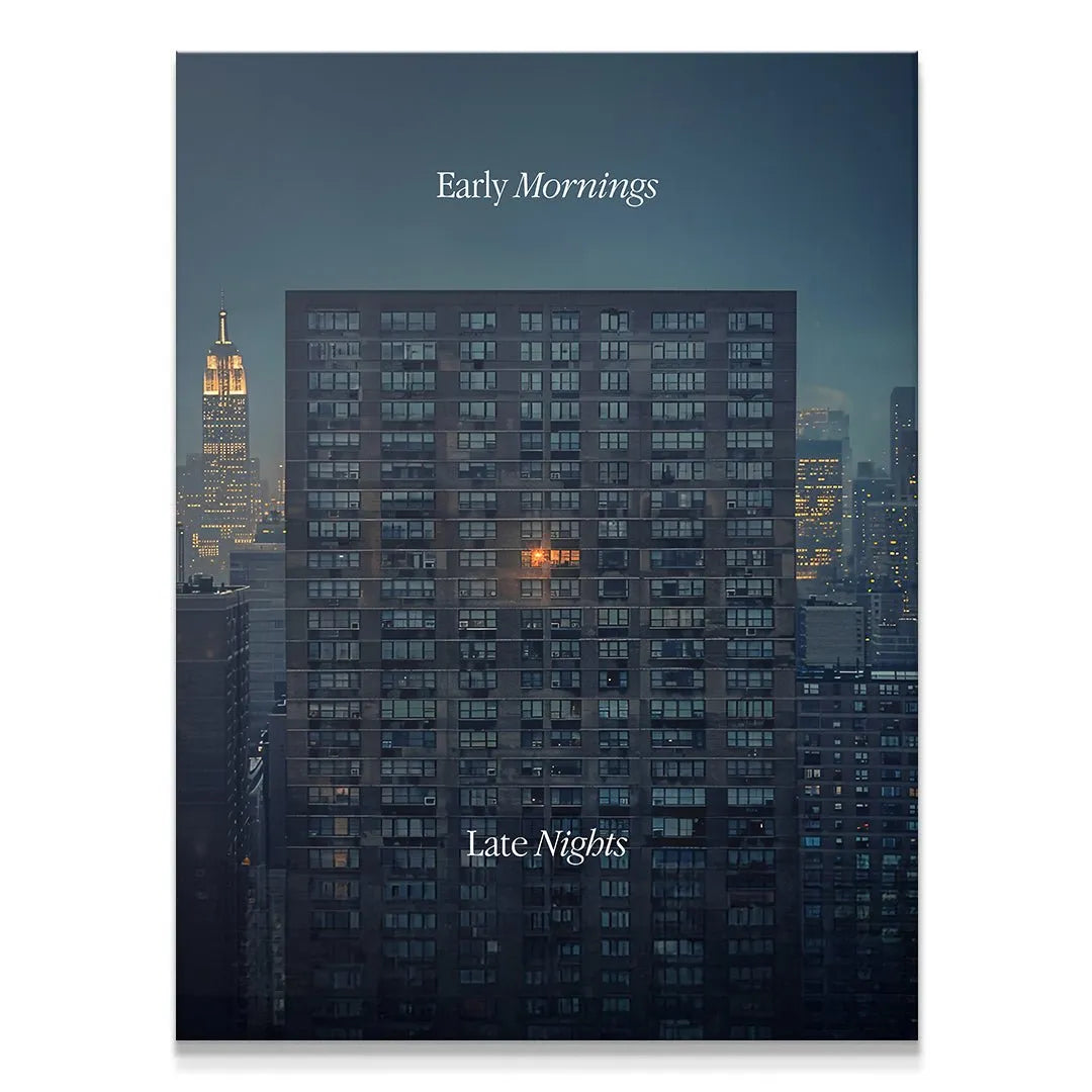 Full vertical shot of the 'Early Mornings, Late Nights' urban apartment block against the twilight sky.