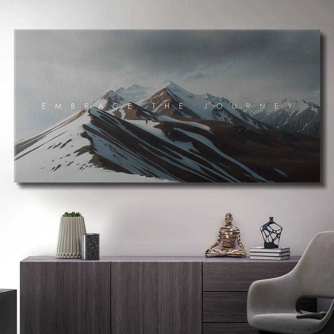 Panoramic landscape artwork showcasing the immense peak elevation with the overlaid mantra 'Embrace The Journey'.