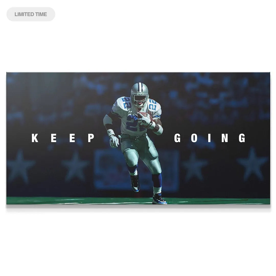 Motivational sports canvas featuring Emmitt Smith - Keep Going running with the football under stadium lights.