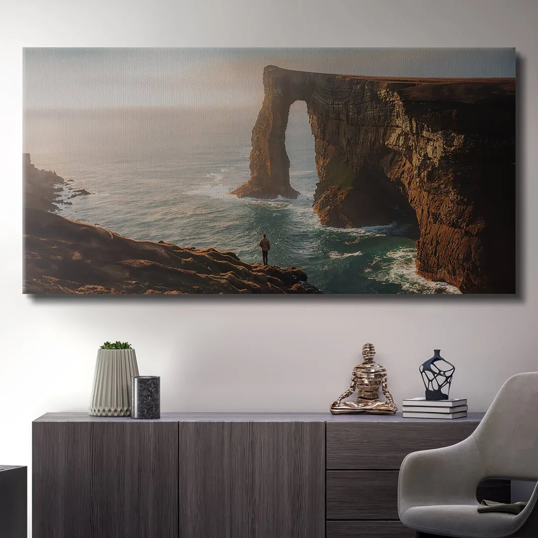 Vertical angle showing the lone figure looking out over the turbulent turquoise water and natural arch: Everything Happens For A Reason (No Quote).