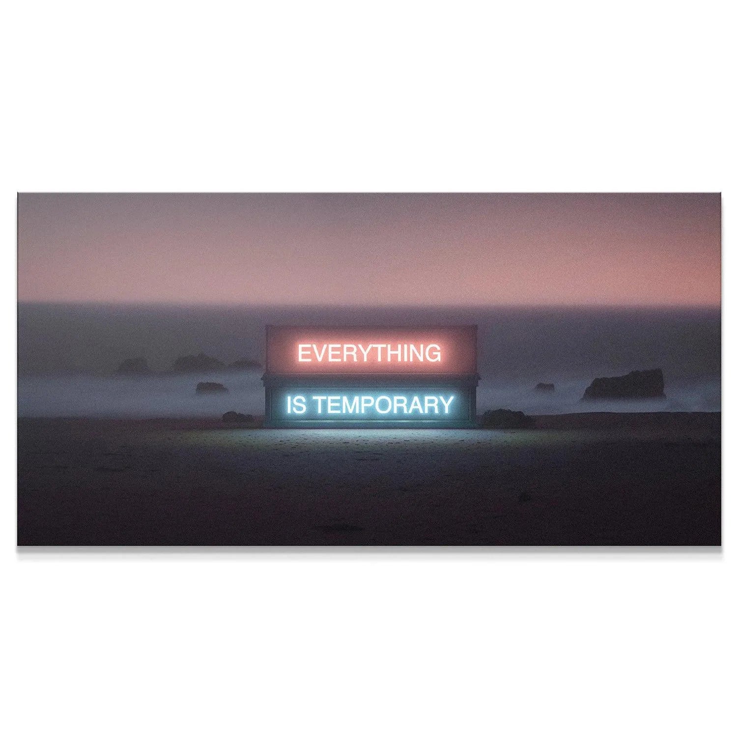 Wide shot of neon sign 'Everything Is Temporary' placed centrally on a dark, misty beach at dusk.