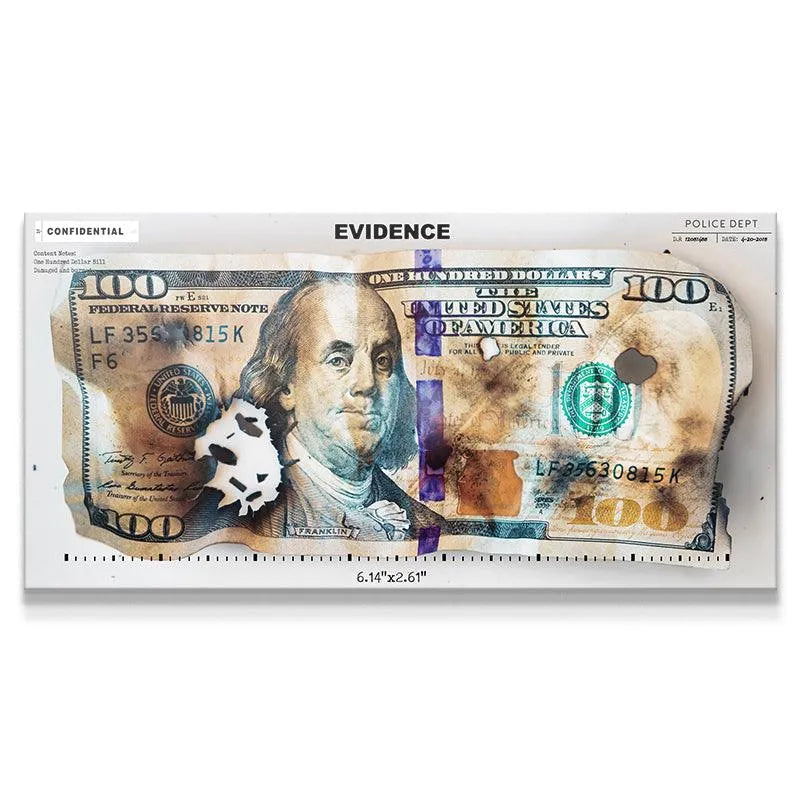 Close-up of the damaged Benjamin Franklin portrait marked as police Evidence.