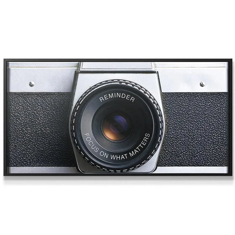Front view of the silver and black vintage 'Focus On What Matters (Camera)' artwork, highlighting symmetry.