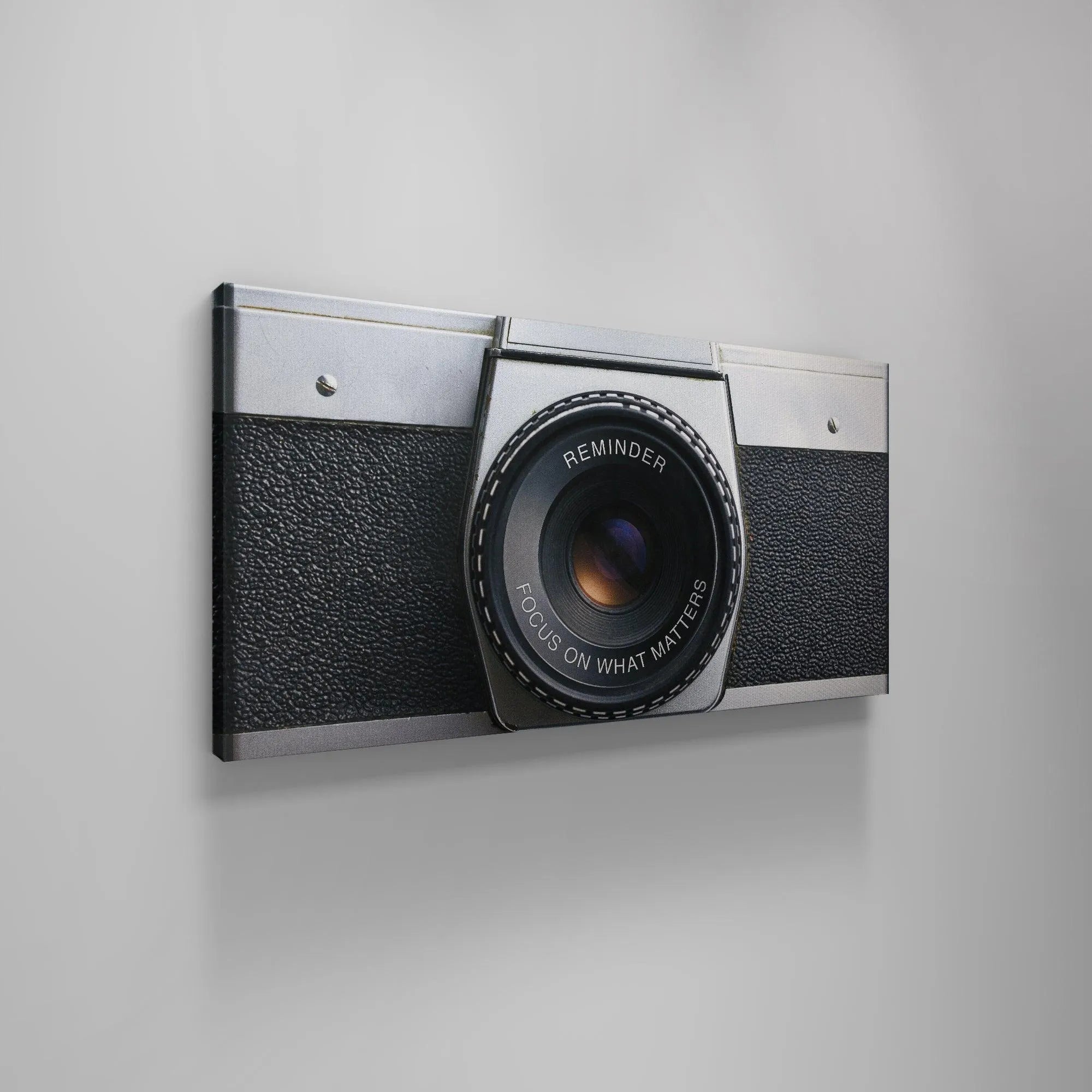 Macro view showing the subtle grain and metallic sheen of the 'Focus On What Matters (Camera)' casing.