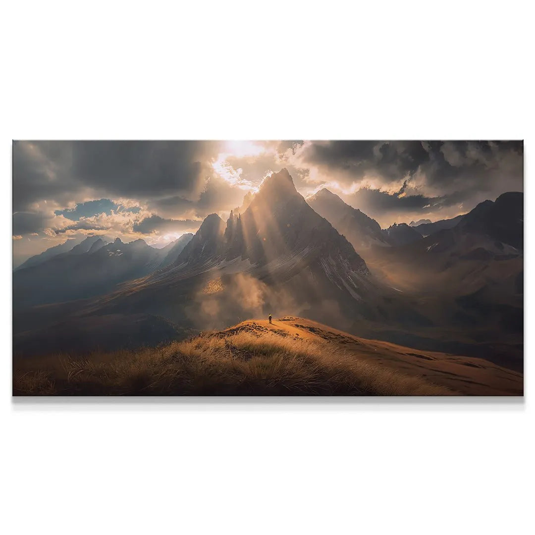 Panoramic view of sunbeams dramatically striking central mountains, symbolizing Focus On What Matters (No Quote).