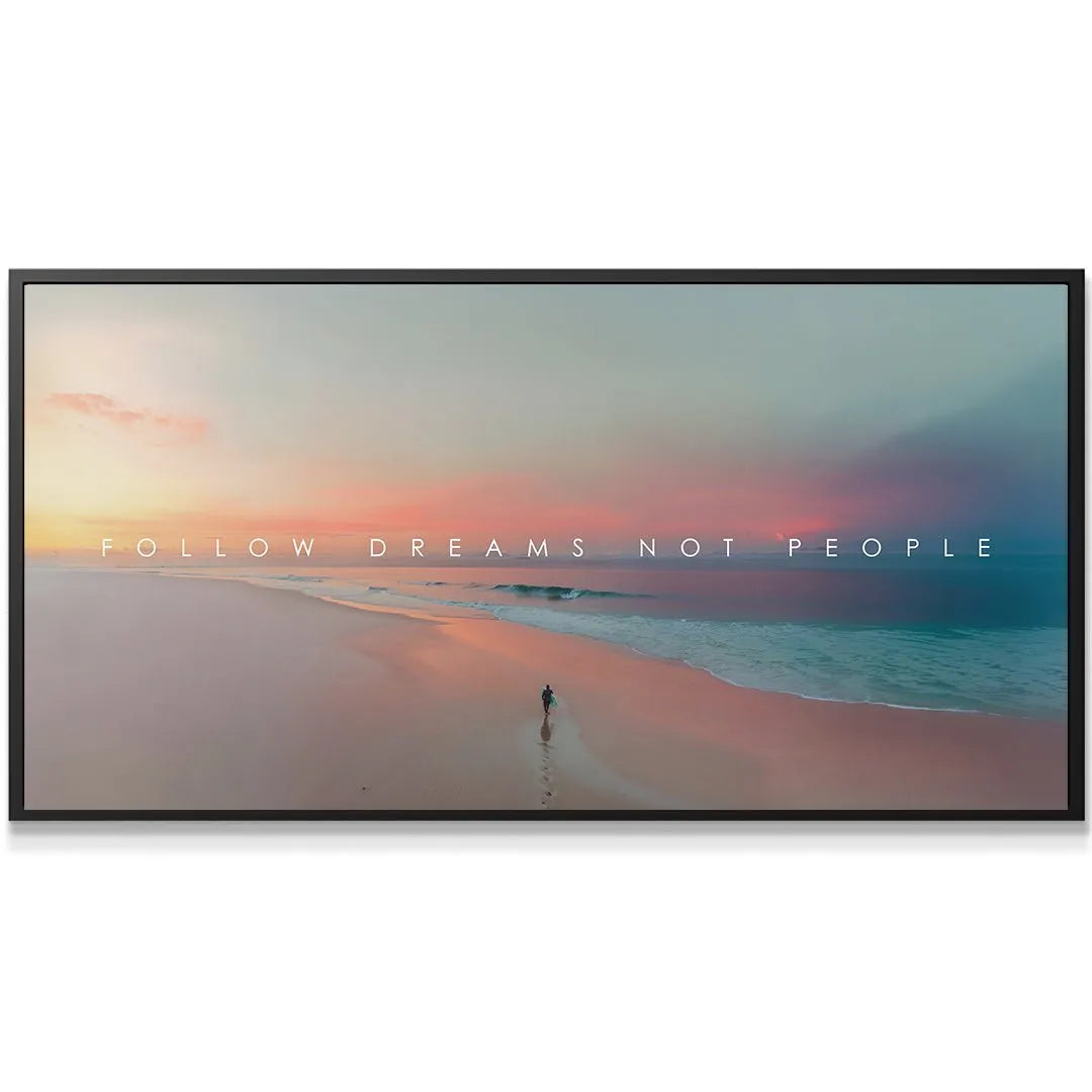 Close-up detail showing the crisp white text 'Follow Dreams Not People' centered against the blended orange and blue sky gradient.