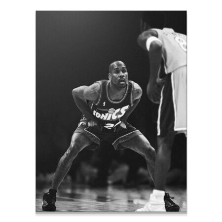 Full vertical shot of Gary Payton - Defense, emphasizing the low, wide stance and court readiness.