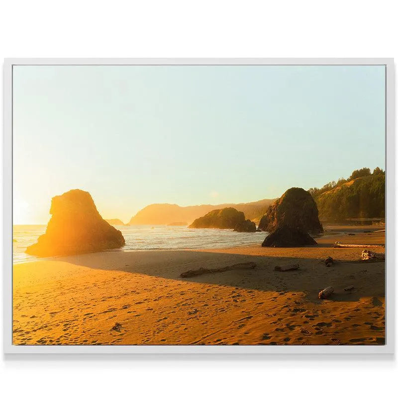 Textured detail of the beach sand reflecting the powerful 'Golden Glow' light source at sunset.