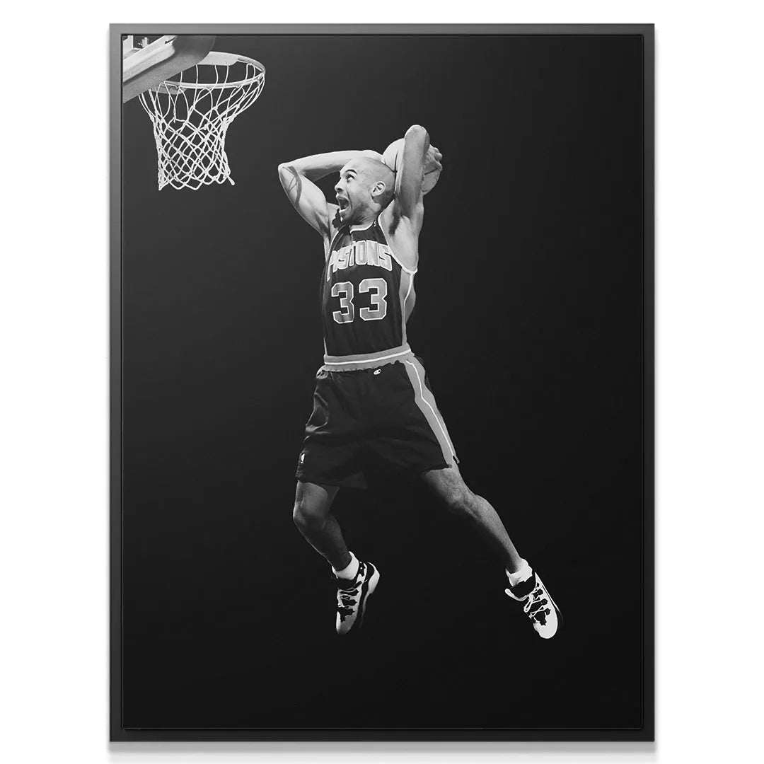 Close-up portrait of the intense facial expression of Grant Hill - #1 during a slam dunk attempt.