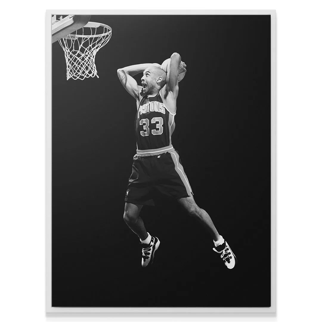 Low-angle view highlighting the vertical jump and athleticism of Grant Hill - #1.