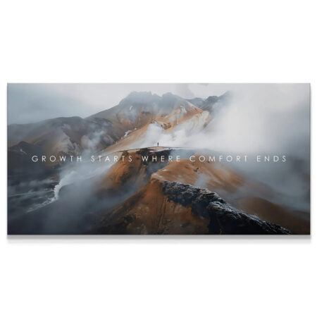 Wide panoramic view of the misty mountain range where Growth Starts Where Comfort Ends, emphasizing the vast scale.