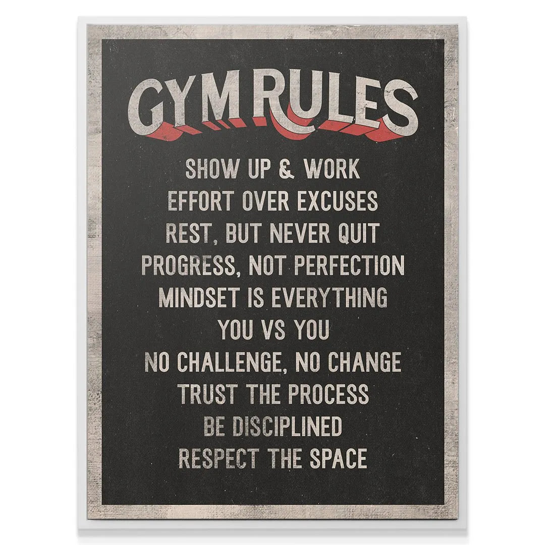 Angled shot of the athletic Gym Rules sign hanging above weightlifting equipment (lifestyle context).