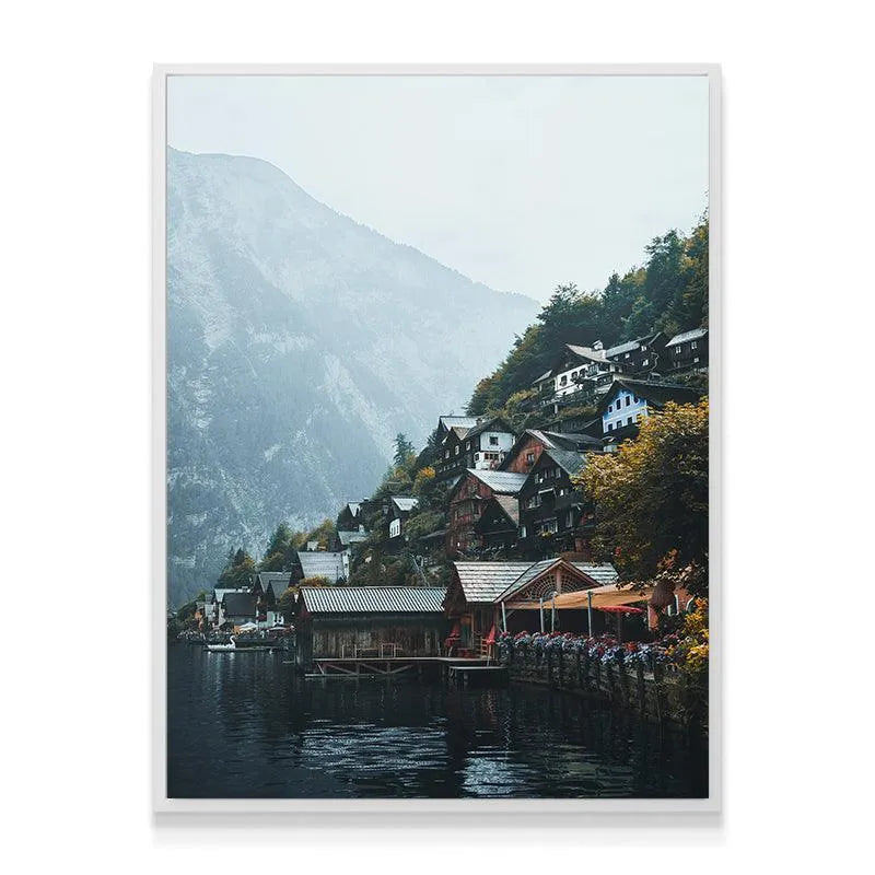 Moody, atmospheric shot of Hallstatt focusing on the misty haze covering the immense mountain peaks.