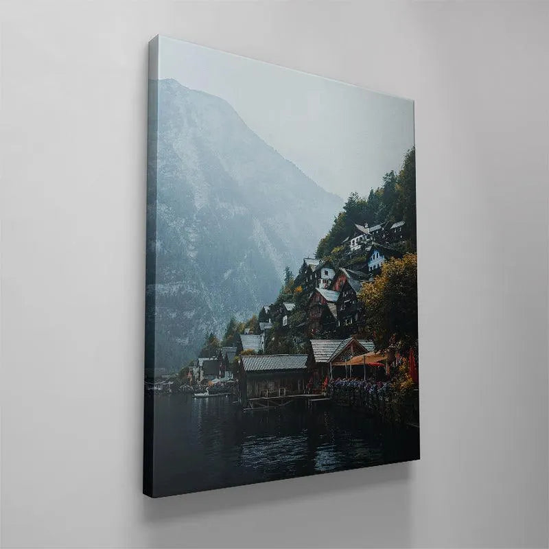Water level perspective of Lake Hallstatt reflecting the iconic shoreline village and boathouses.