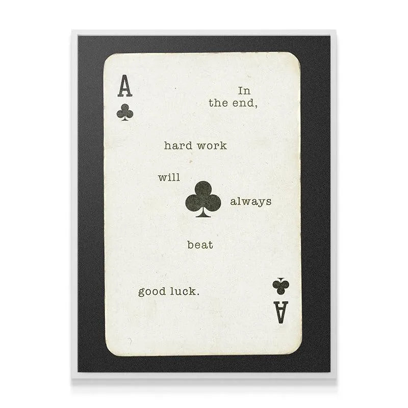 Textured detail of the aged paper aesthetic on the 'Hard Work Beats Good Luck' card art.