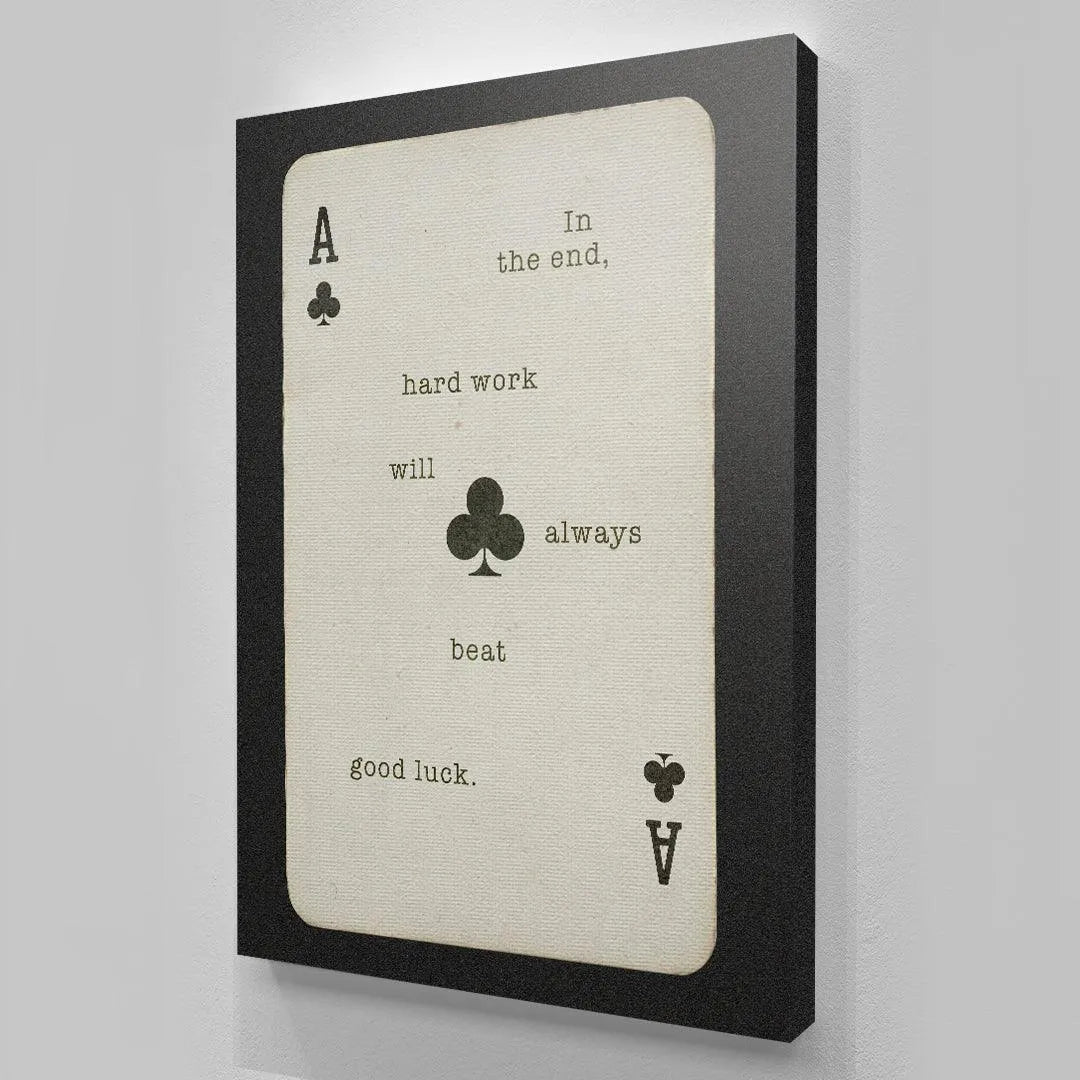 The black border surrounding the vintage playing card featuring the quote 'Hard Work Beats Good Luck'.