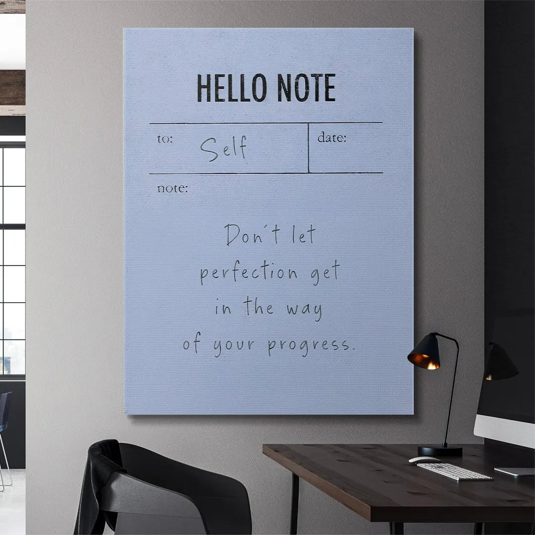 Lifestyle image of the Hello Note (Blue) placed next to a coffee cup and pen on a wooden desk.