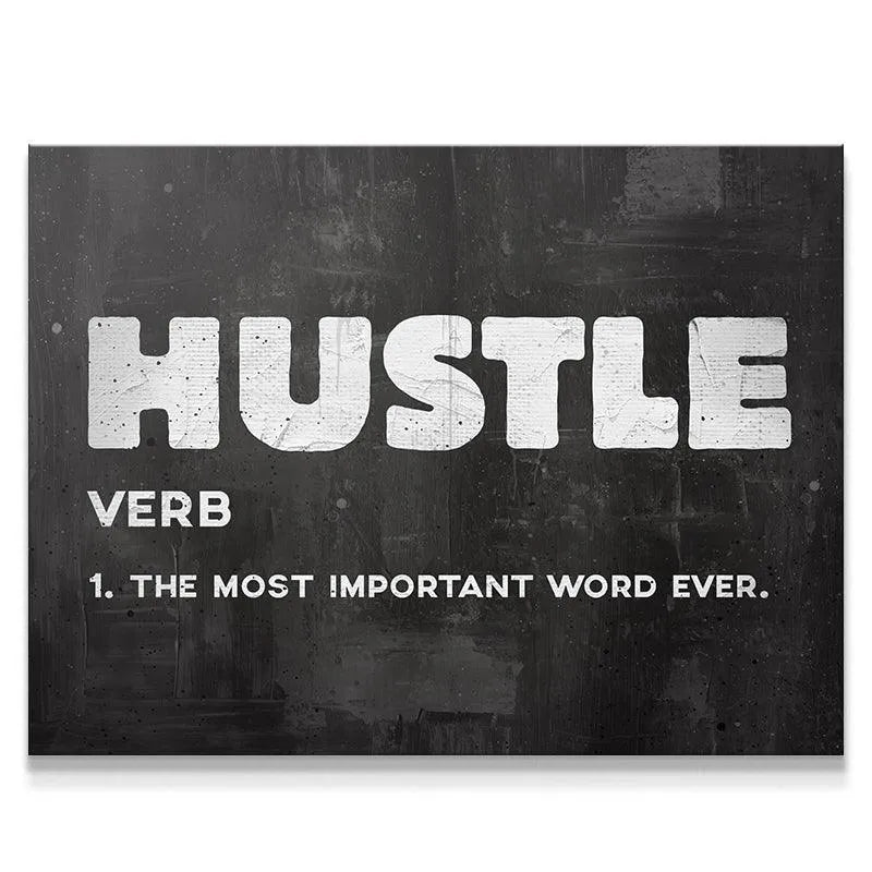 Close-up view of the distressed, chalky texture of the word Hustle in white ink.