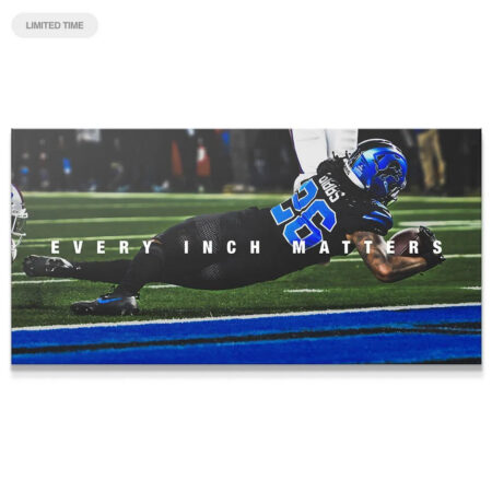 Jahmyr Gibbs - Every Inch Matters: Action shot of the running back diving for a touchdown across the goal line.