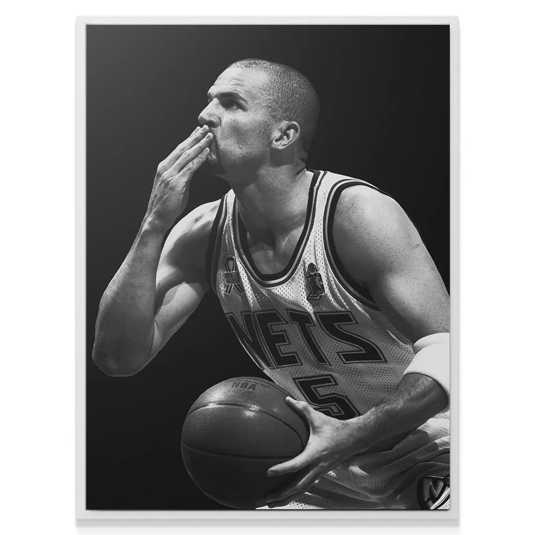 Emotional sideline view of Jason Kidd - #1 celebrating a major play victory while holding the basketball.