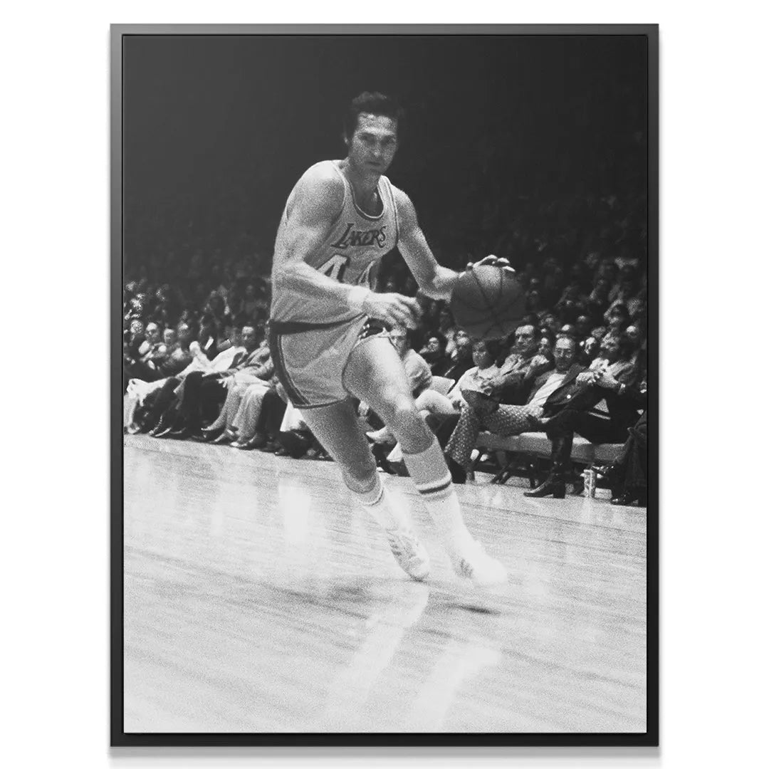 Detailed close-up capturing the intense facial expression of Jerry West - #1 while handling the ball.