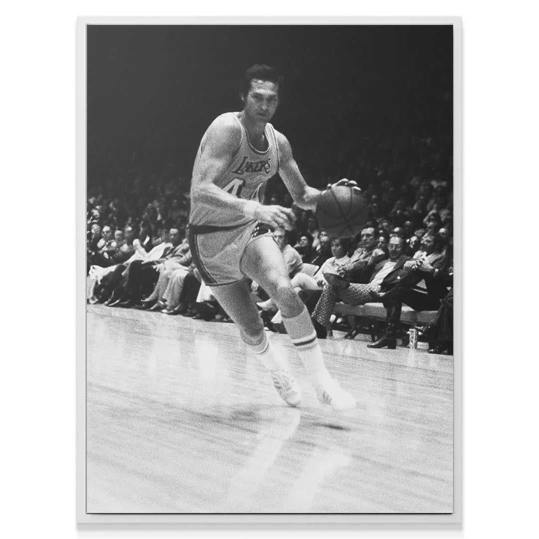 Black and white image highlighting the classic Lakers uniform worn by Jerry West - #1.
