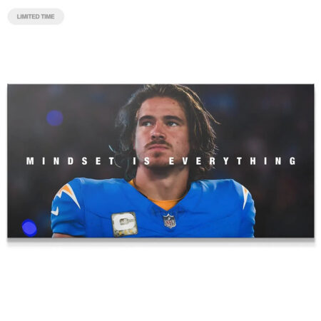 Close-up portrait of QB Justin Herbert under stadium lights, featuring the motivating text "Justin Herbert - Mindset Is Everything."