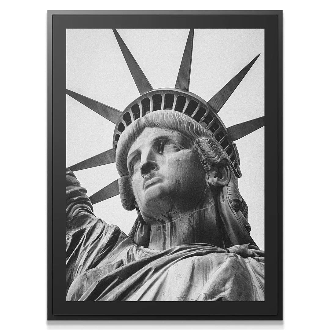 Dramatic low-angle view emphasizing the colossal scale of the crown of Lady Liberty.