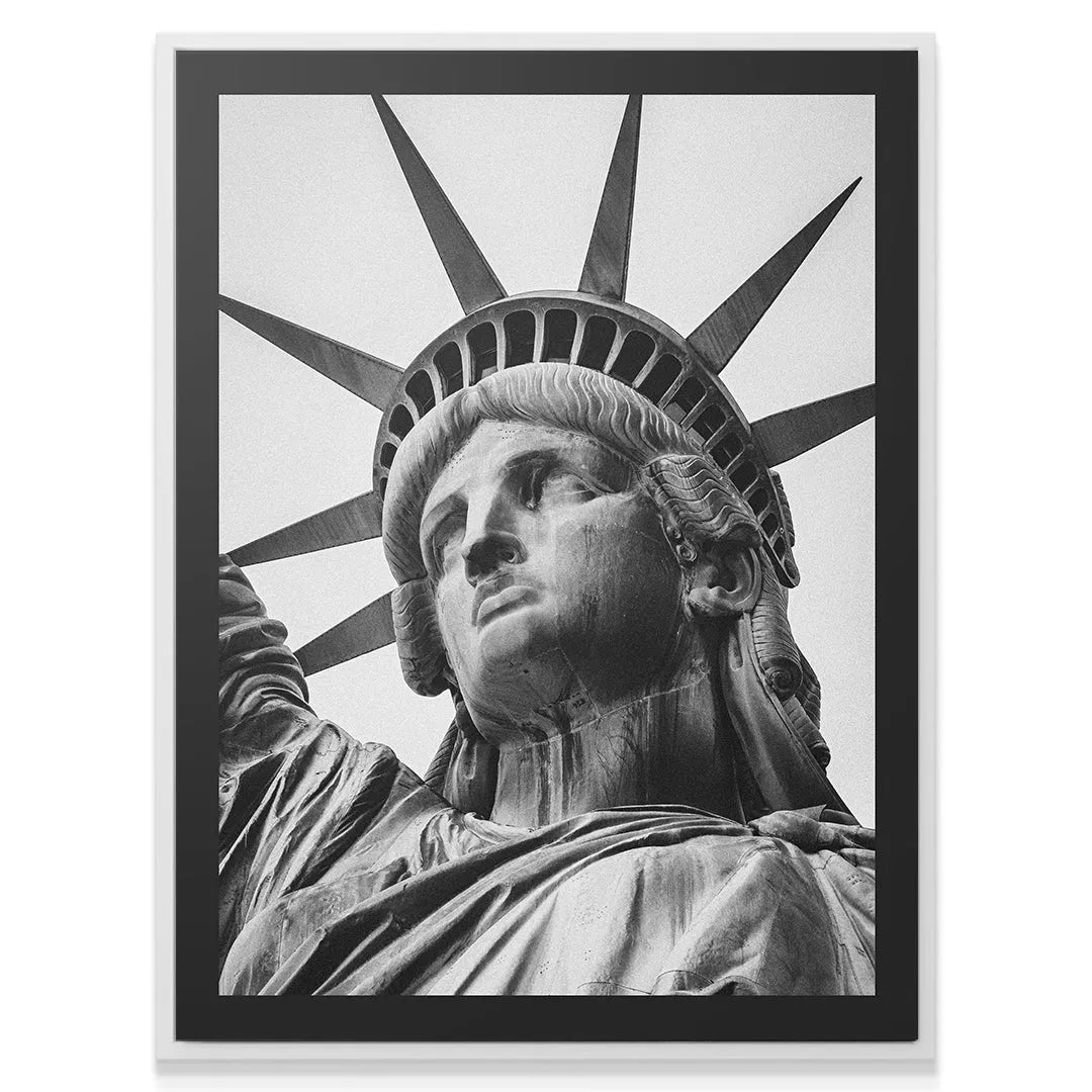 Detailed crop showing the flowing draped shoulder robes of Lady Liberty.