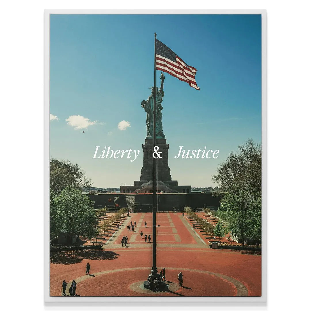 Detail of the Statue of Liberty pedestal base and the white text overlay for 'Liberty & Justice 2'.