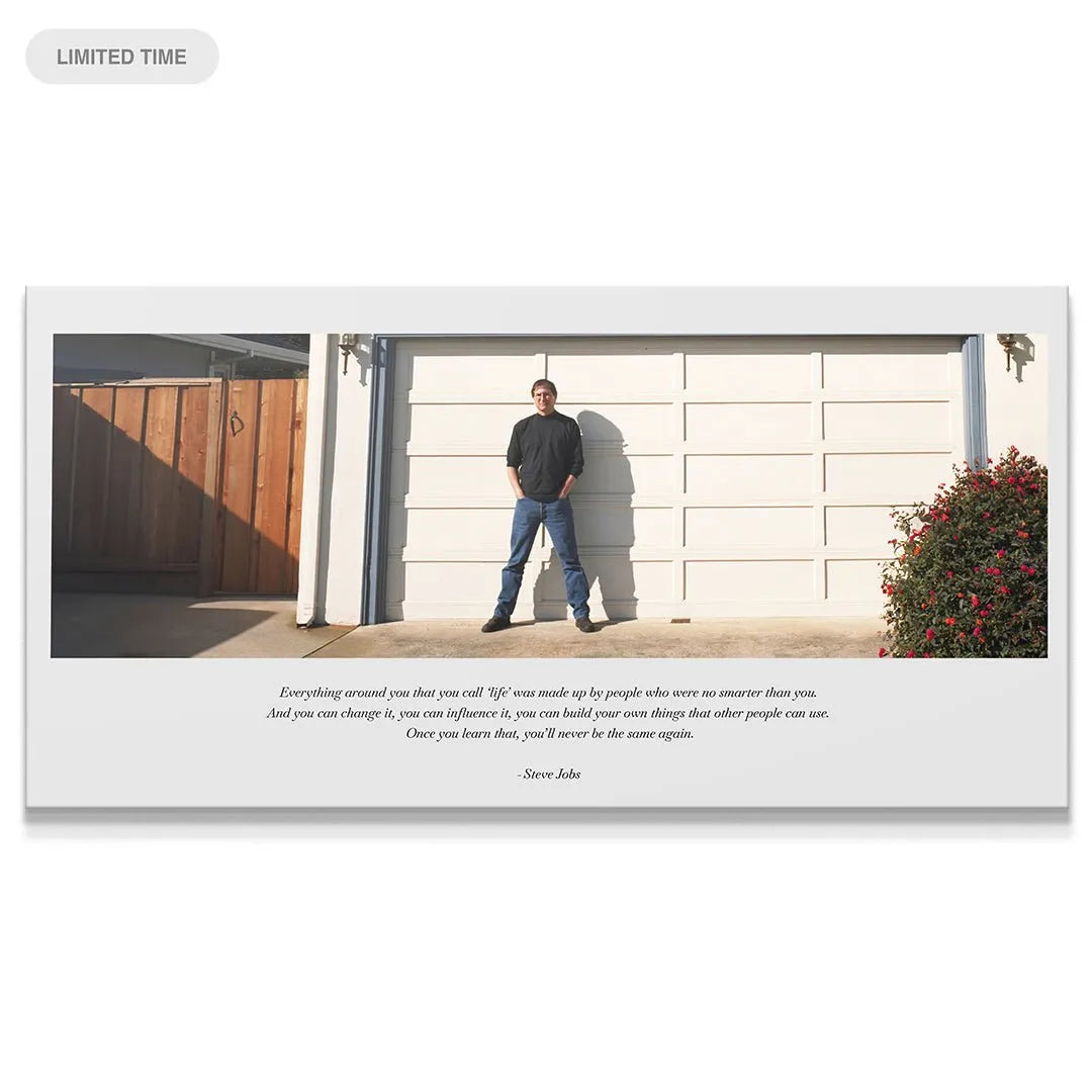 Full panoramic view of Steve Jobs standing by the white garage door, embodying 'Life (Jobs)'.