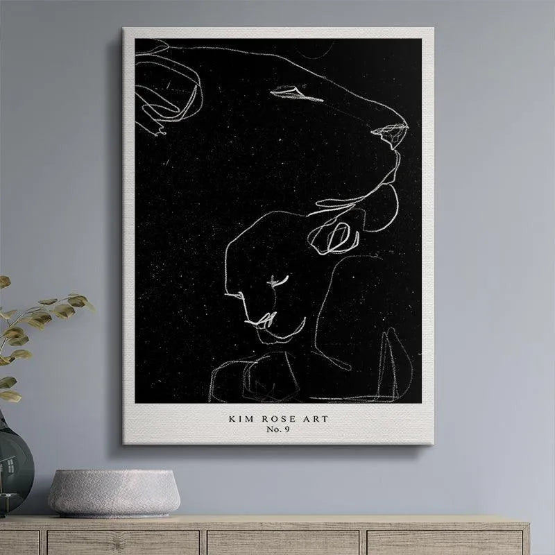 Lifestyle mock-up featuring the framed 'Lioness - Black' print hanging above a contemporary sofa.