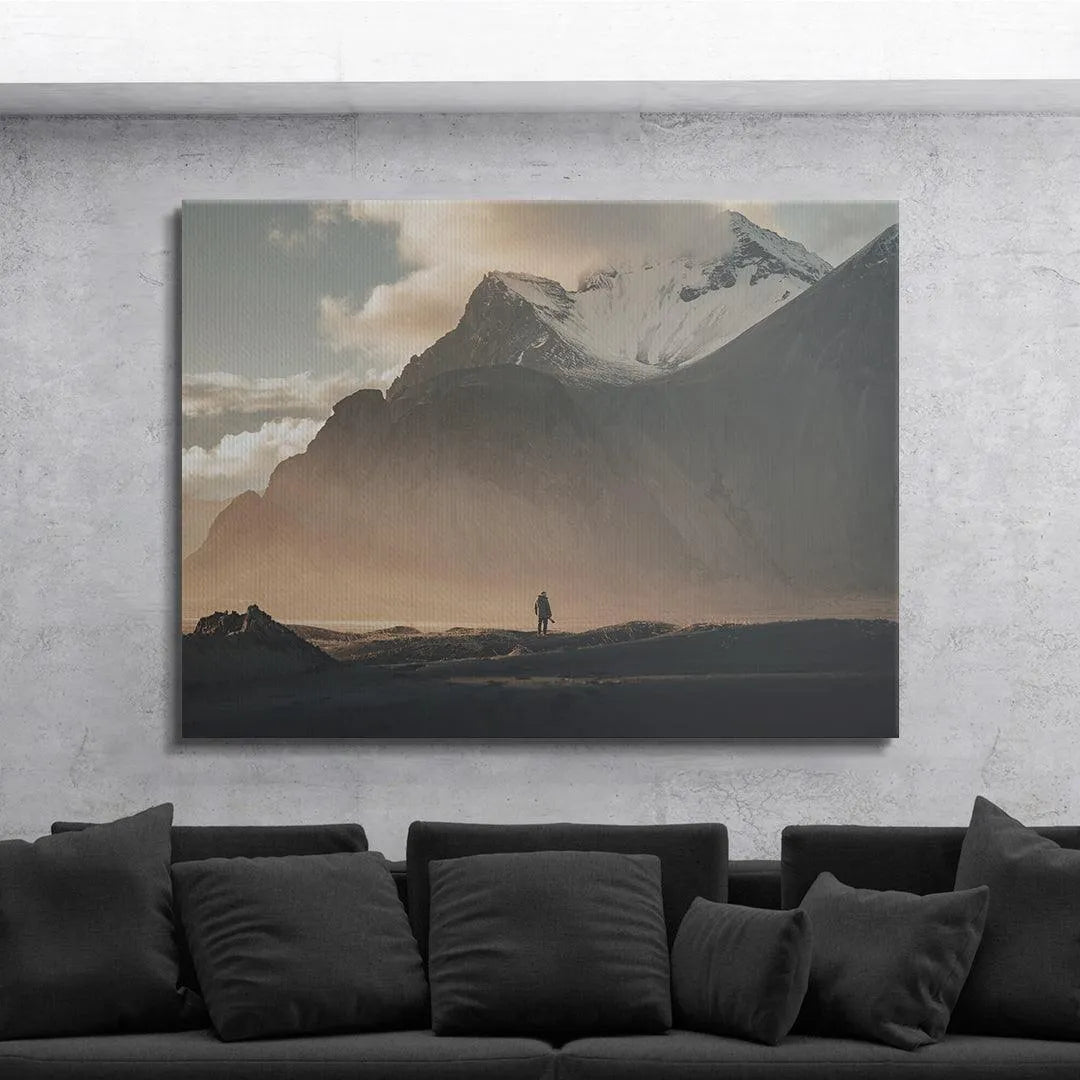 Detail of the solitary figure positioned against the immense, overwhelming scale of the mountainside captured in 'Lonely Stokk'.